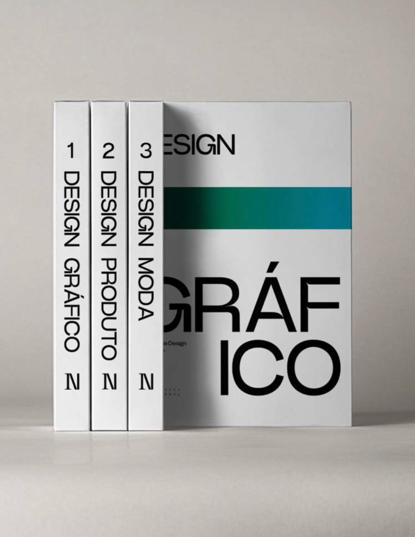 Os três volumes alinhados pela lombada, com a capa de Design Gráfico